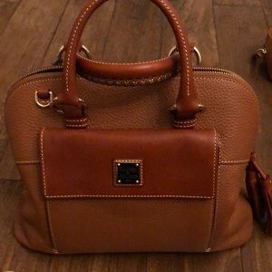 Dooney and Bourke caramel pebble leather shoulder bag with accessories.
